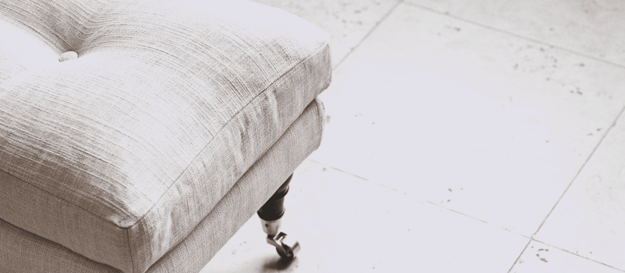 A MELIMELI sofa shown against a soft, neutral backdrop